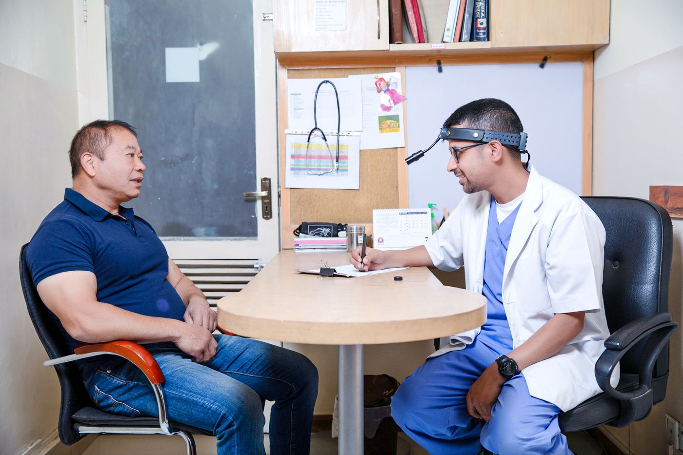 An ENT specialist with a patient