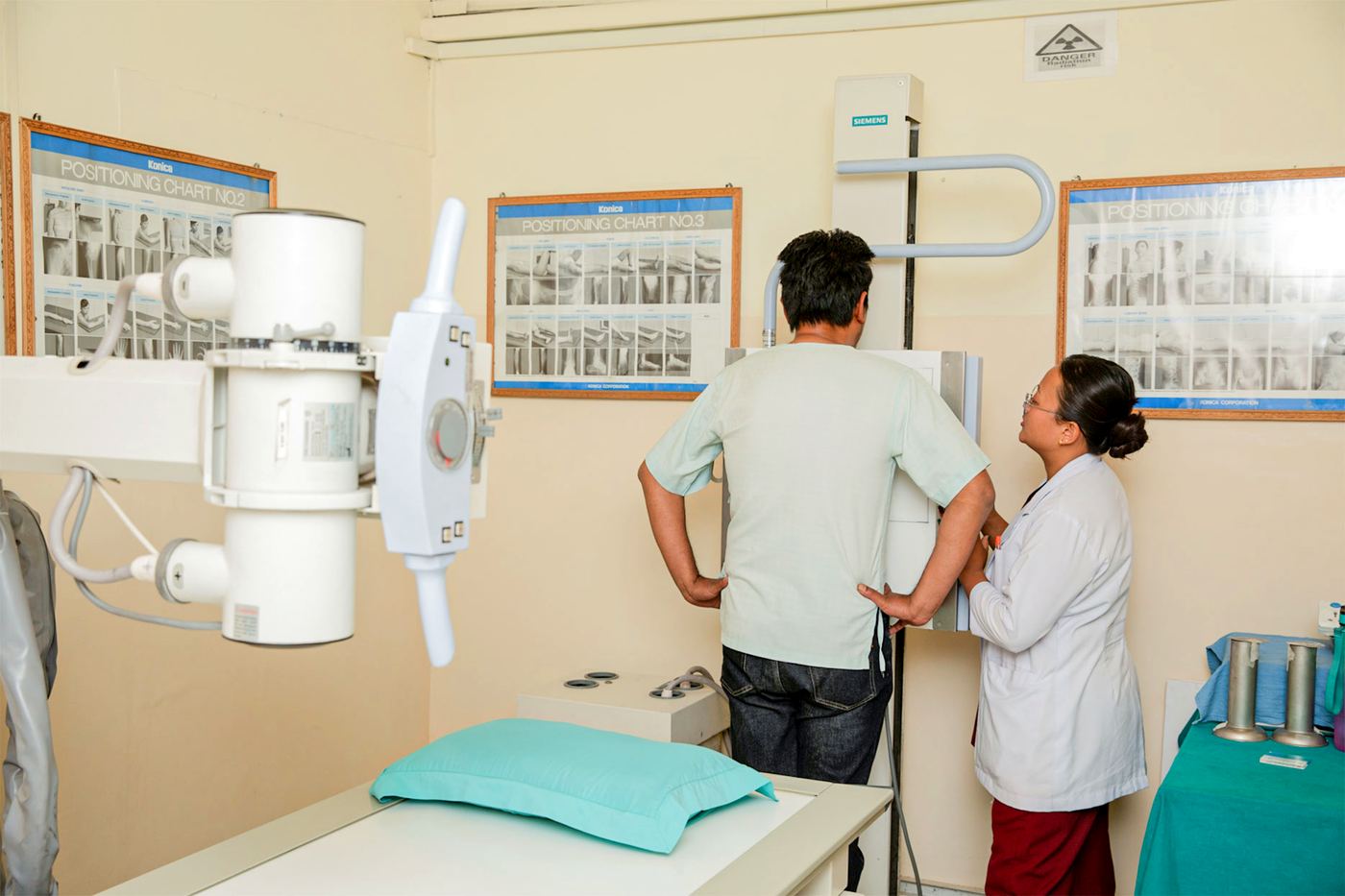 A patient having a chest X-ray